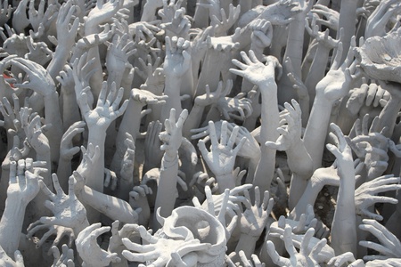 Hands Statue from Hell in Wat Rong Khun at Chiang Rai, Thailandの写真素材