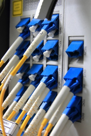 fiber optical network cable and servers in a technology data centerのeditorial素材