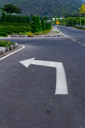 Arrow turn left on street