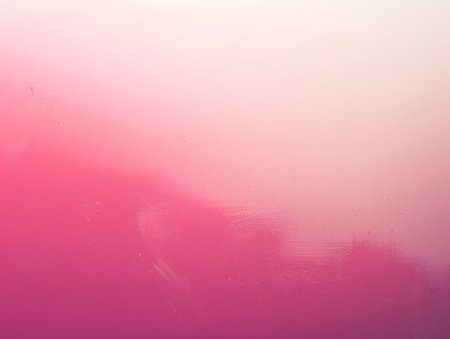 A soft gradient of pink hues blending into a lighter background.の素材