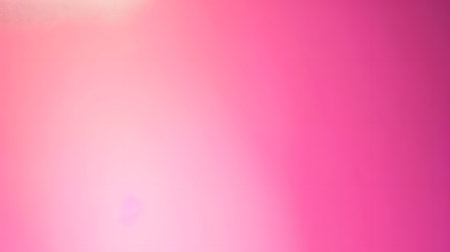 A vibrant pink gradient background with soft lighting effects.の素材