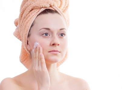 Beautiful girl does creamの写真素材