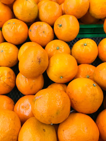 Tangerines on display at the grocery store. Close up.の写真素材