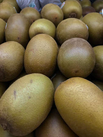Kiwi fruit on the counter in the supermarket. Close-up.の写真素材