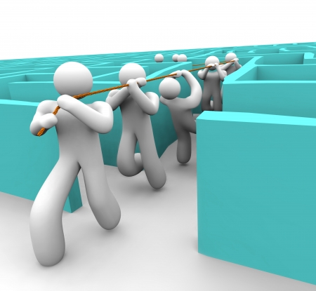 A leader pulls his team out of a confusing labyrinthの写真素材