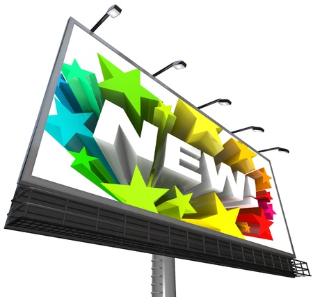 The word new surrounded by colorful stars displayed on a billboard announcing and advertising a new and improved product or serviceの写真素材