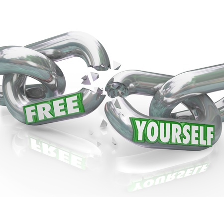 The words Free Yourself on chain links breaking apart representing a fight for freedom and...