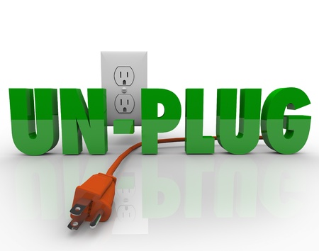 The word Unplug in green letters with an orange electrical cord disconnected from the power outlet