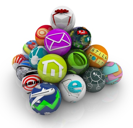 Many mobile apps and software programs illustrated by spheres in a pyramid shape to symbolize an app store marketplace for downloading games and utilities to your smart phone or tablet computerの写真素材