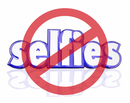 No Selfies symbol on 3d letters to illustrate people being annoyed with self portraits taken on digital camera phones and posted on social mediaの写真素材