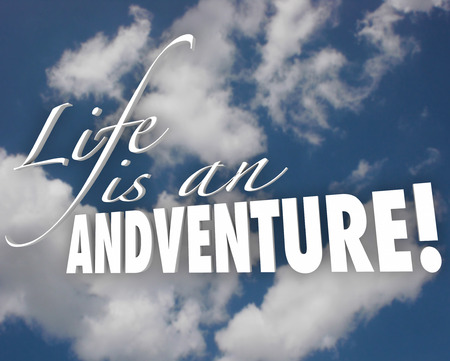 Life is an Adventure words in white 3d letters on a cloudy blue sky to illustrate motivation and inspiration in accepting risk and being bold, brave or courageous in livingの写真素材
