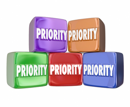 Priority word on 3d cubes or blocks to illustrate ranking the most important jobs, tasks, projects or considerations to pay attention and completeの写真素材