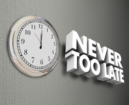 Never Too Late words in 3d letters on a wall next to a clock to symbolize improving yourself through...
