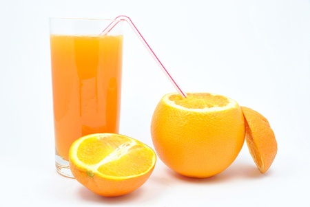 orange juice and oranges on a white backgroundの写真素材