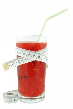 Watermelon juice and meter on white backgroundの写真素材