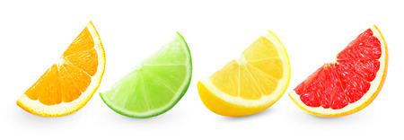 citrus fruit pieces on a white background の写真素材