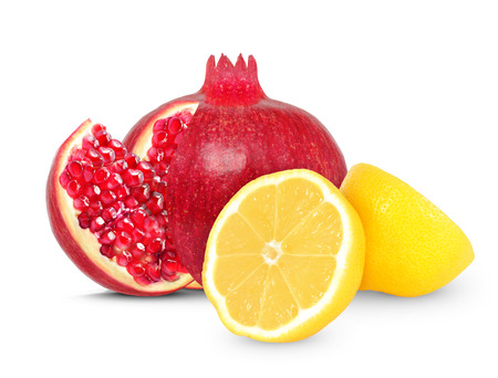pomegranate and lemon isolated on whiteの写真素材