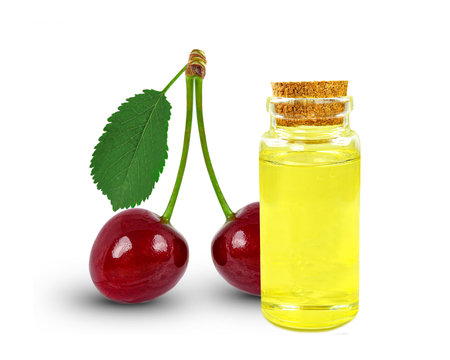 cherry seed oil in bottle isolated on white backgroundの写真素材