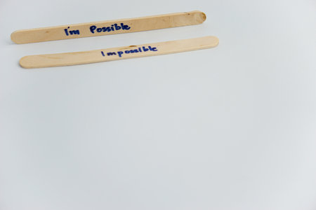 handwriting messages on ice cream sticks in close-up as a concept for building self-esteem