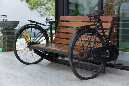A unique bench design featuring vintage bicycle wheels for a rustic charm.