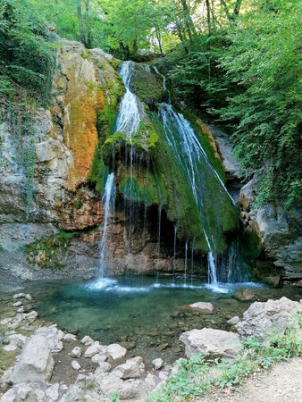 Waterfall in the forest. Summer landscape. Waterfall in the forest.のeditorial素材