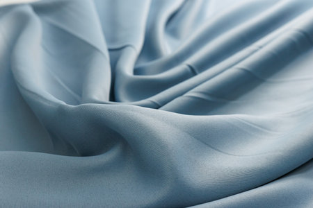 Closeup of blue satin fabric, can be used as wedding backgroundの写真素材