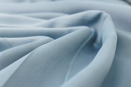 close up of blue silk fabric texture background, shallow depth of fieldの写真素材
