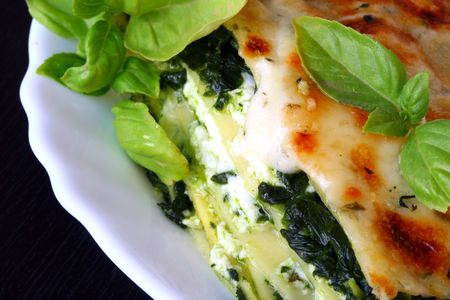 Vegetarian lasagna with ricotta cheese spinach filling and basilの写真素材