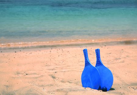 bat and ball on the sandy beachの写真素材