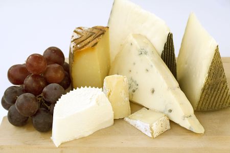 An assortment of cheeses on a cheese-boardの写真素材