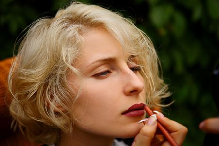 beautiful sexy woman put in on make-upの写真素材