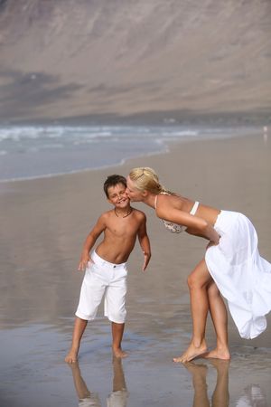 Mother and son on the beachの写真素材