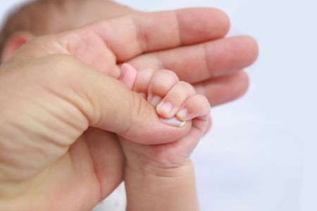 Mother's and baby's hands の写真素材