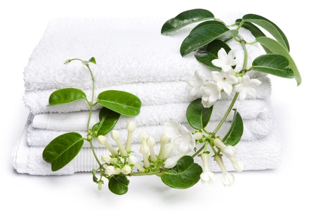 White towels  with white flowers for wellness の写真素材