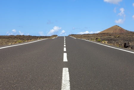 Empty road an arid mountain, Lanzarote, Canary islands, Spain 