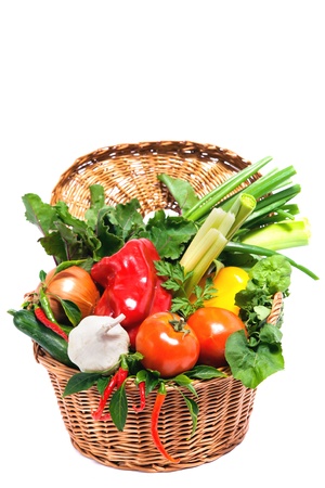 Fresh vegetables in basket isolated on white の写真素材
