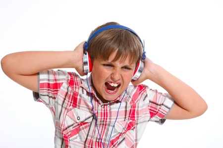 portrait of boy boy sings a song with headphones の写真素材