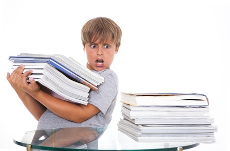 Too much information  The boy was horrified to look at the books that should have been studied の写真素材