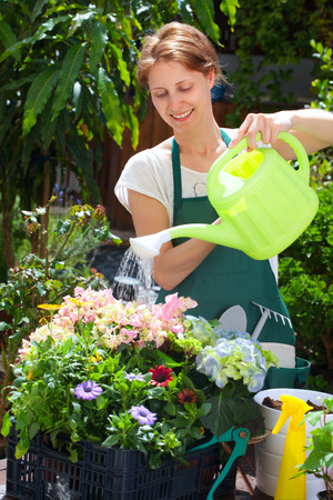 Young woman gardening outdoorの写真素材