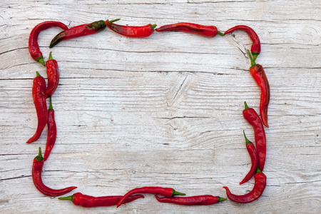 frame pepper on a wood boardの写真素材