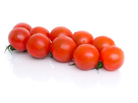 cronie fresh red tomatoes on branch isolated backgroundの写真素材