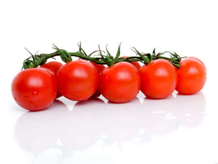cronie fresh red tomatoes on branch isolated backgroundの写真素材