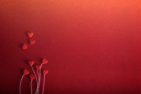 Romantic hearts on a red background. The concept for Valentine's day. Decorative background. Valentines card with line heartの写真素材