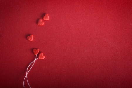 Romantic hearts on a red background. The concept for Valentine's day. Decorative background. Valentines card with line heartの写真素材