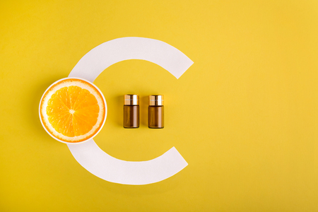 Serum and cosmetics with vitamin C. Essential oil from citrus fruits.の写真素材