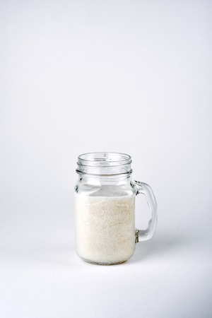 Protein cocktail with milk, vanilla in a glass jar with straws. Sports nutritionの写真素材