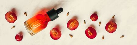Grape seed oil. Creative still life of grapes, seeds and a bottle on a light background. Flat lay.の写真素材