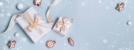 Christmas holiday composition, white gift boxes and golden Minimalism, flat lay.の写真素材