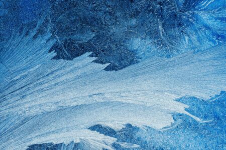 Frosty pattern on transparent background. Background light blue winter. Blue backdrop beautiful...