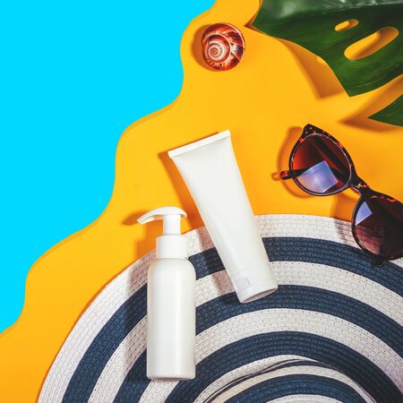 Sunprotection objects. Hat with sunglasses and protection cream SPF Beach accessories. Summer Travel...